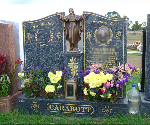 European-style Christian-themed granite headstone